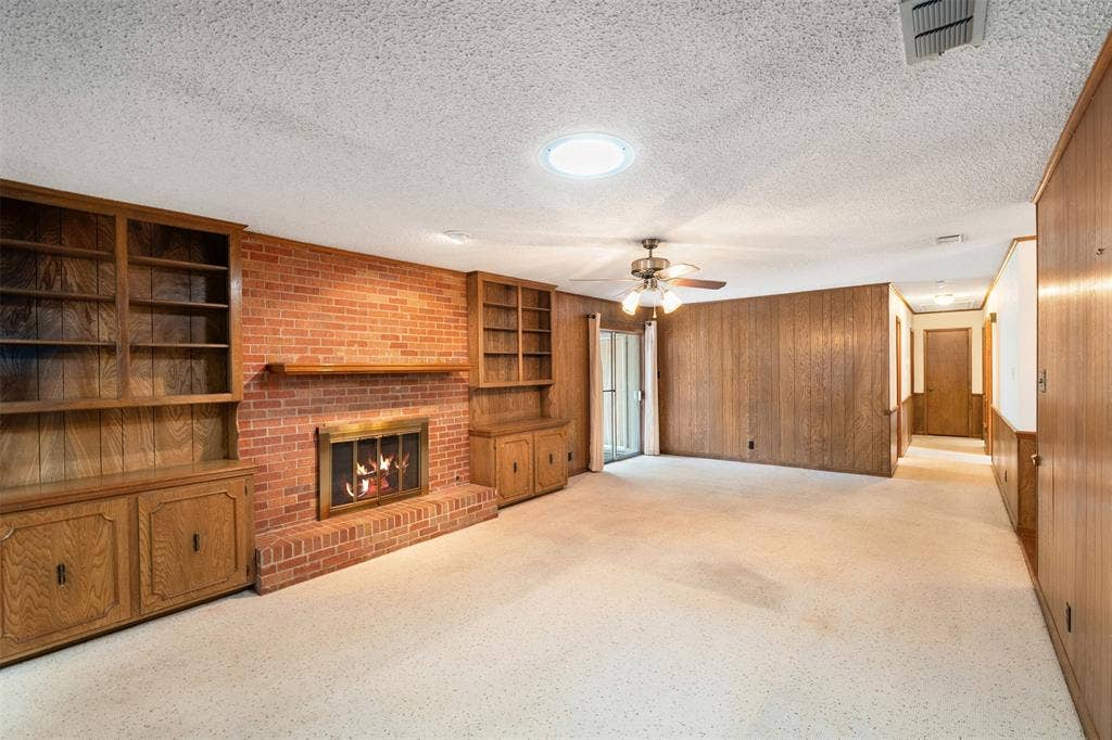 925 Bradley Drive, Athens, TX 75751 Living room with wood burning fireplace and built in cabinets