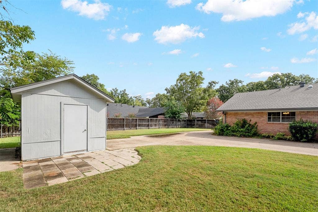 925 Bradley Drive, Athens, TX 75751 Backyard with storage shed
