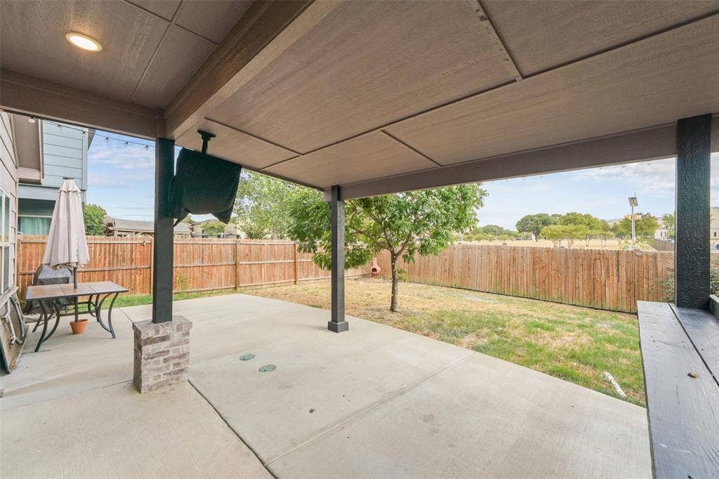 4651 Raleigh Dalton Road, Dallas, TX 75227 Covered patio with recessed lighting, concrete flooring, and brick-wrapped support columns