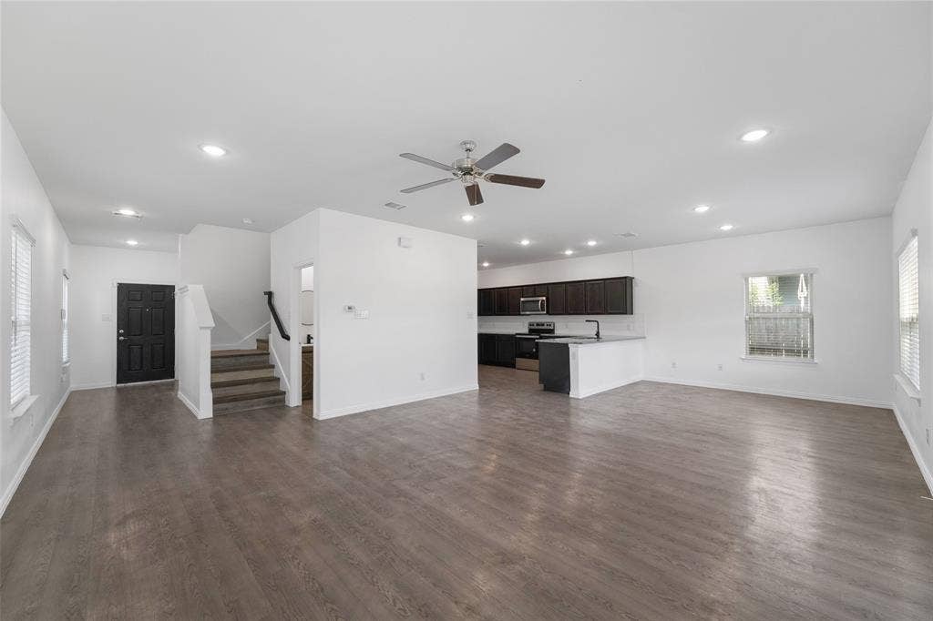 4651 Raleigh Dalton Road, Dallas, TX 75227 Open-concept living space featuring wood-finish flooring, recessed lighting, and a ceiling fan