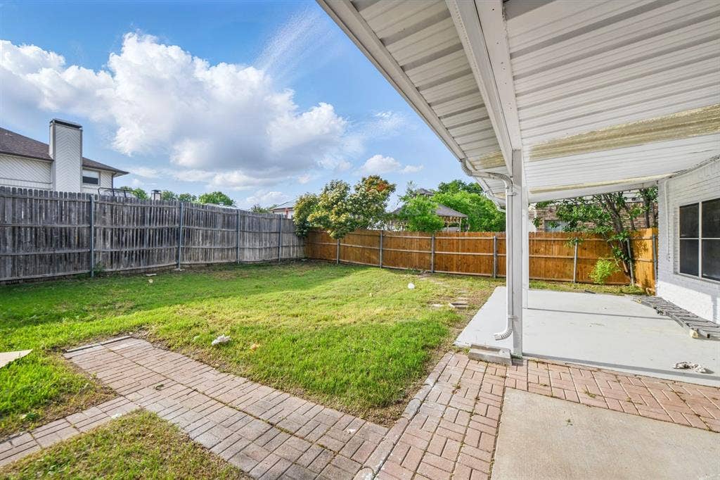 6833 Lyndale Drive, Watauga, TX 76148 Fenced backyard with a patio area