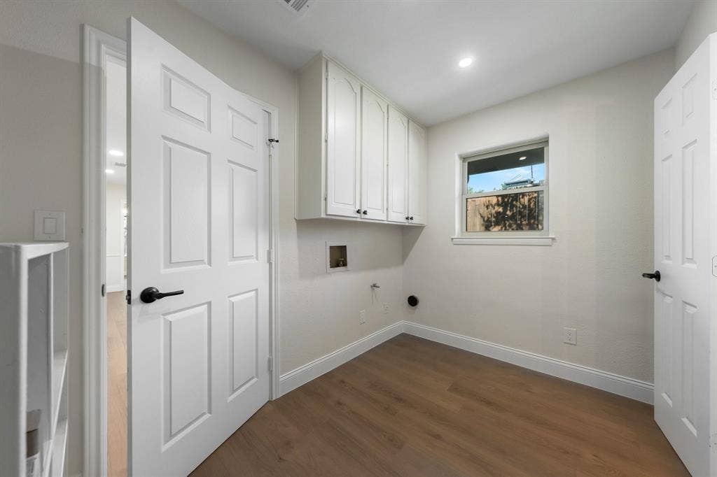 2844 Hurstview Drive, Hurst, TX 76054 Utility room with cabinetry