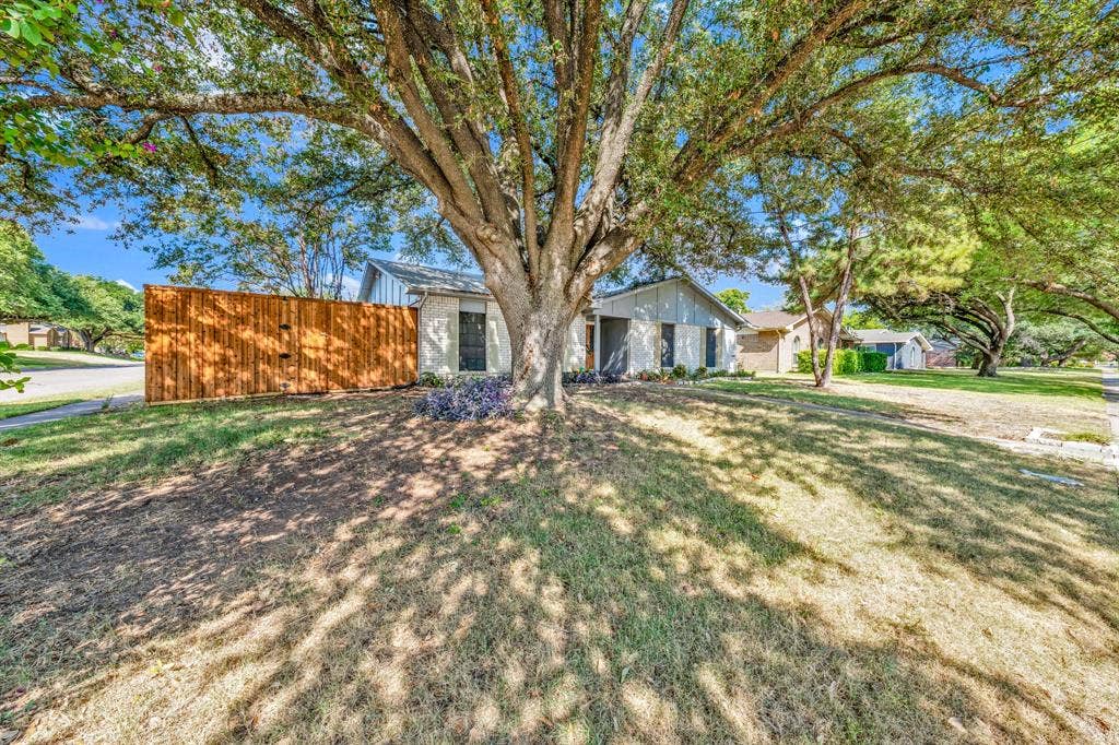 1715 Cherokee Trail, Plano, TX 75023 Mature trees provide ample shade to the front yard