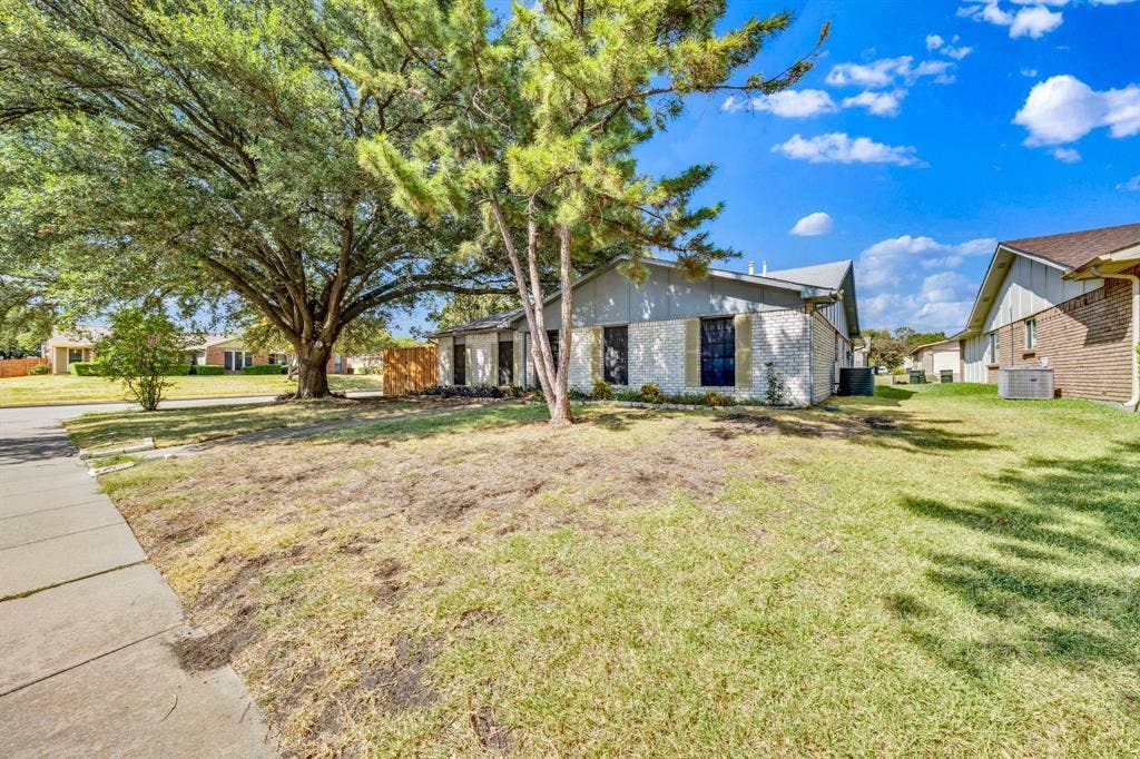 1715 Cherokee Trail, Plano, TX 75023 Mature trees provide ample shade to the front lawn