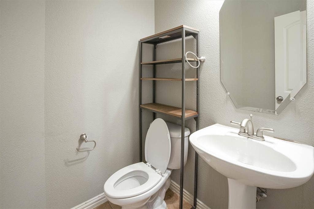 1441 Fox Run Drive, Irving, TX 75063 Half bathroom on the main floor.