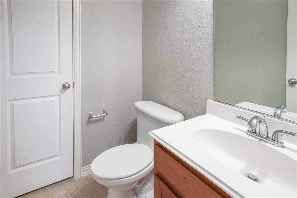 1441 Fox Run Drive, Irving, TX 75063 Half bathroom off downstairs den