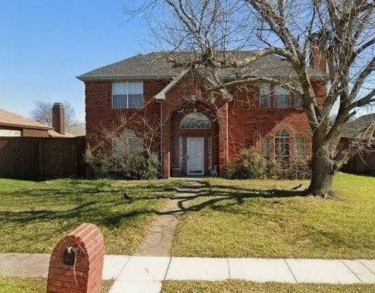 6708 Aimpoint Drive, Plano, TX 75023 Brick exterior with arched entry and transom window, front yard with mature tree, and concrete pathway