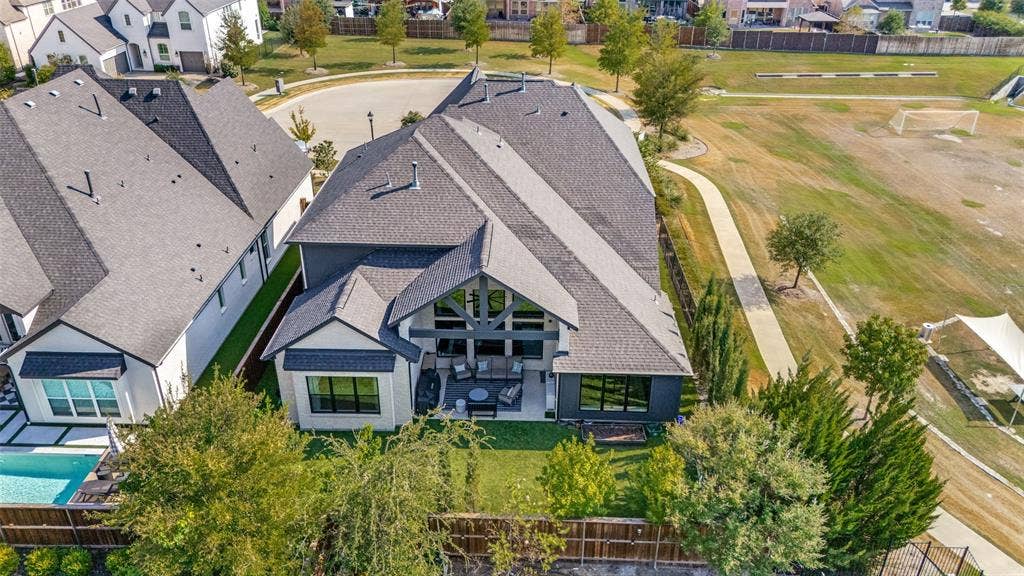 15018 Crape Myrtle Road, Frisco, TX 75035 Modern exterior with a multi-gabled roofline and a rear patio