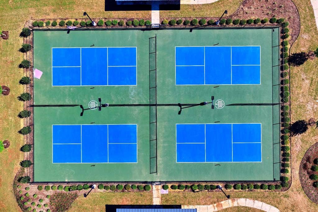 15018 Crape Myrtle Road, Frisco, TX 75035 Four dedicated pickleball courts with vibrant blue playing surfaces and green surrounds