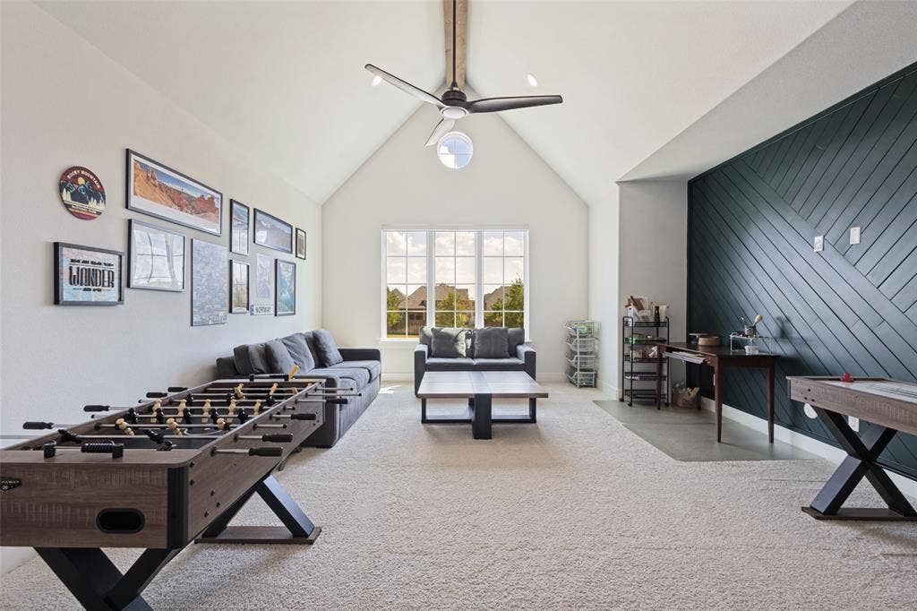 15018 Crape Myrtle Road, Frisco, TX 75035 Spacious living area featuring a vaulted ceiling, ceiling fan, and carpeted flooring