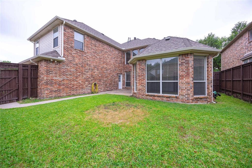 3305 Estacado Lane, Plano, TX 75025 Brick exterior with a gabled roof and bay windows