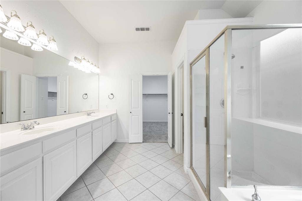 3305 Estacado Lane, Plano, TX 75025 Dual vanity with extensive countertop space, individual sinks, and overhead lighting