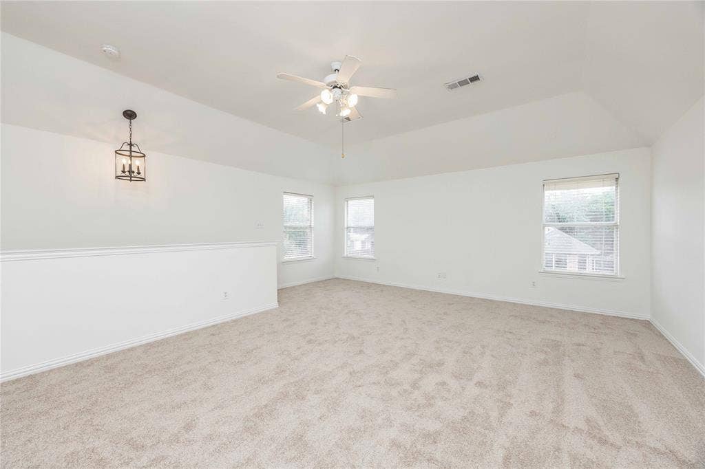 3305 Estacado Lane, Plano, TX 75025 Vaulted ceiling with ceiling fan, recessed windows, and carpet flooring