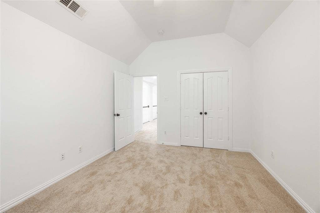 3305 Estacado Lane, Plano, TX 75025 Vaulted ceiling, neutral tone walls, carpeted flooring, paneled interior doors, and baseboard molding
