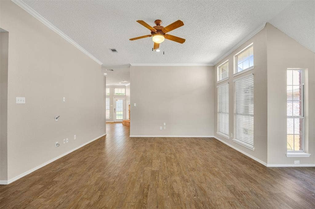 12 Harper Drive, Allen, TX 75002 Looking from front door towards kitchen...bedrooms 2-4 on the left.