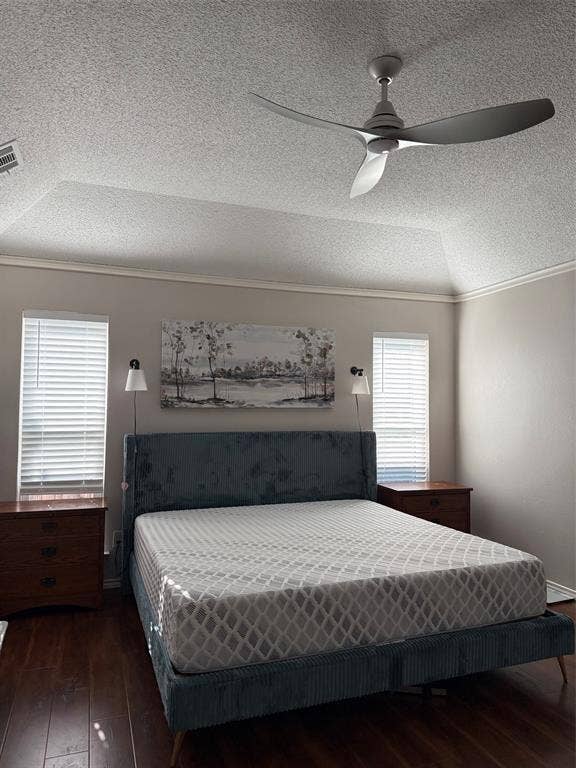 1517 Aylesbury Lane, Plano, TX 75075 Vaulted ceiling with a ceiling fan, recessed lighting, wood-finish flooring, crown molding, and dual windows with blinds