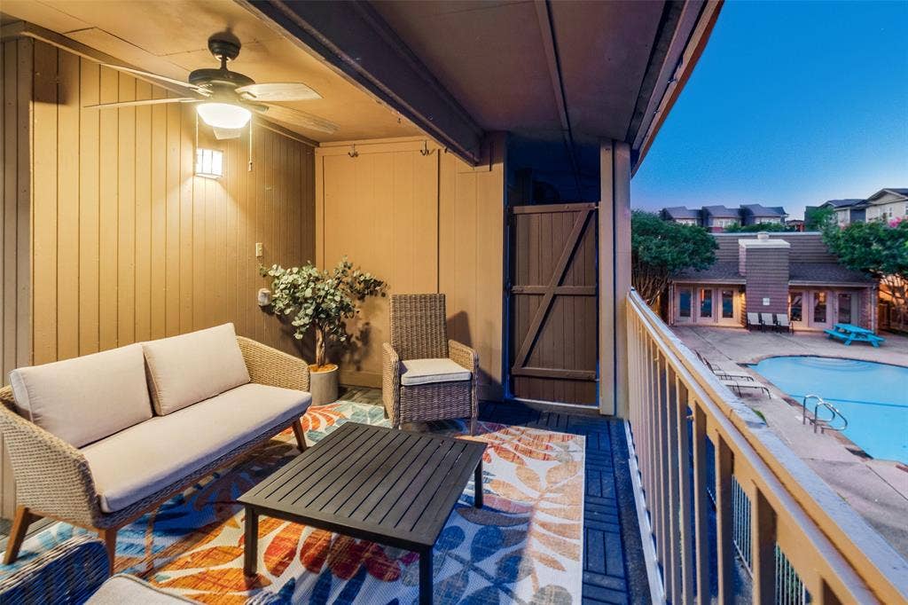 5140 Amesbury Drive, #212, Dallas, TX 75206 Spacious balcony with direct access to pool via staircase