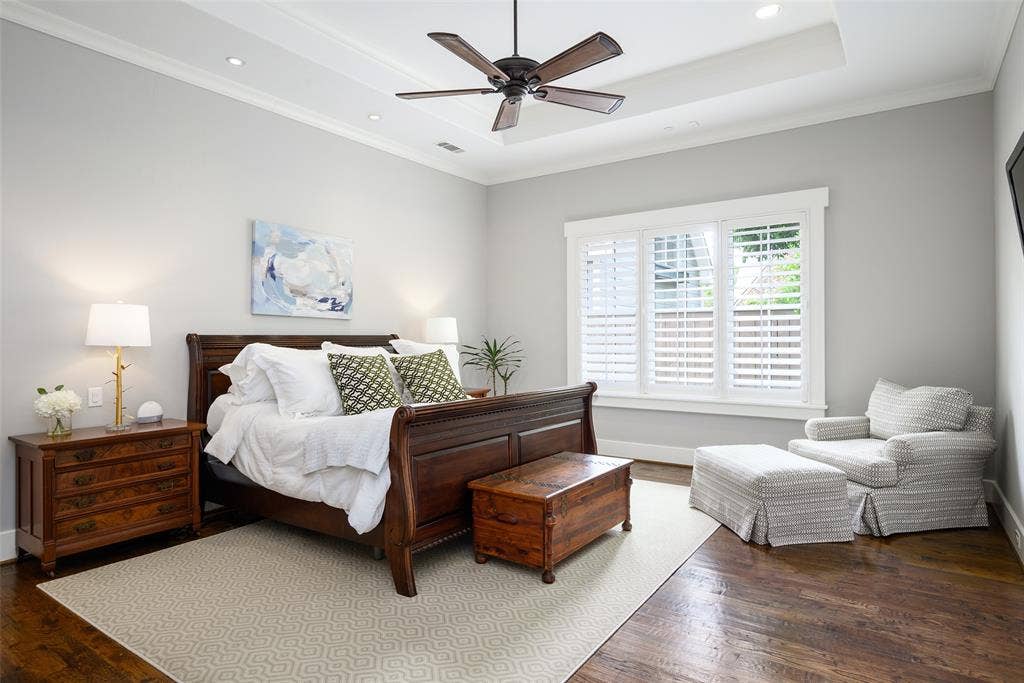 3420 Hanover Street, University Park, TX 75225 Hardwood flooring, tray ceiling with recessed lighting, ceiling fan, and plantation shutters