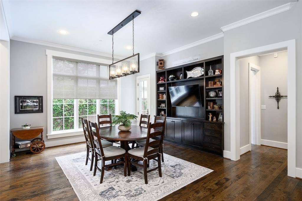 3420 Hanover Street, University Park, TX 75225 Hardwood flooring, recessed lighting, built-in shelving, crown molding, and a rectangular multi-light chandelier