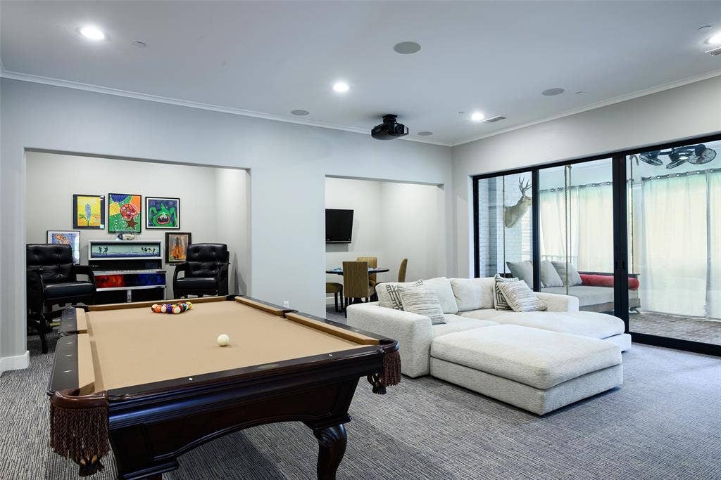 3420 Hanover Street, University Park, TX 75225 Recessed lighting, crown molding, built-in ceiling speakers, projector, and large sliding glass doors