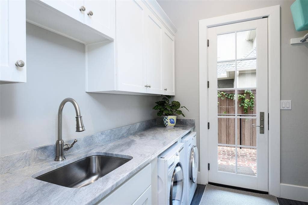 3420 Hanover Street, University Park, TX 75225 White cabinetry, undermount sink, stone countertop, brushed nickel faucet, and a glass-paned door