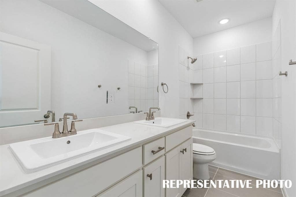 3601 Shepherd Way, McKinney, TX 75071 Featuring dual sinks, this guest bath offers guests their own vanity space. REPRESENTATIVE PHOTO