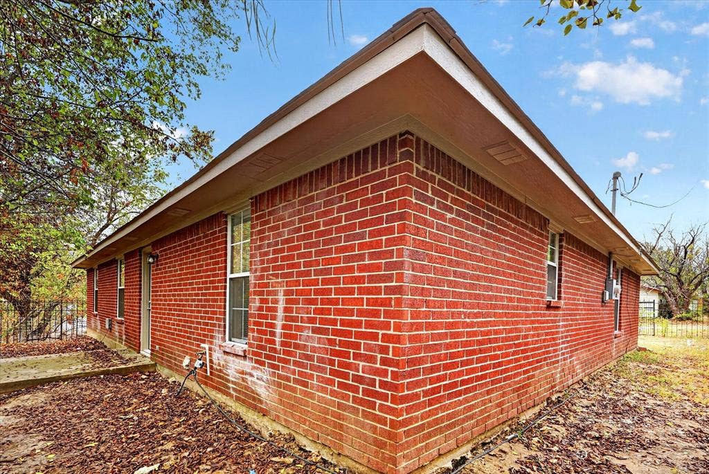 201 West Lane, West Tawakoni, TX 75474 Red brick exterior with white trim