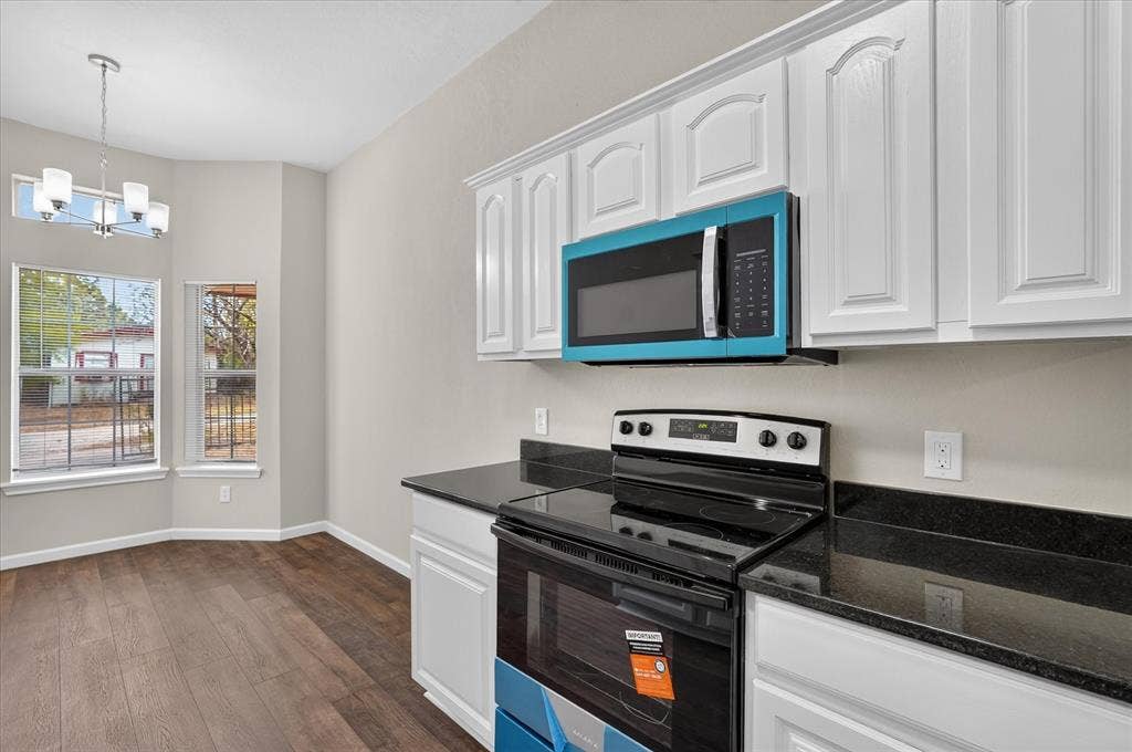 201 West Lane, West Tawakoni, TX 75474 White cabinetry with black countertops
