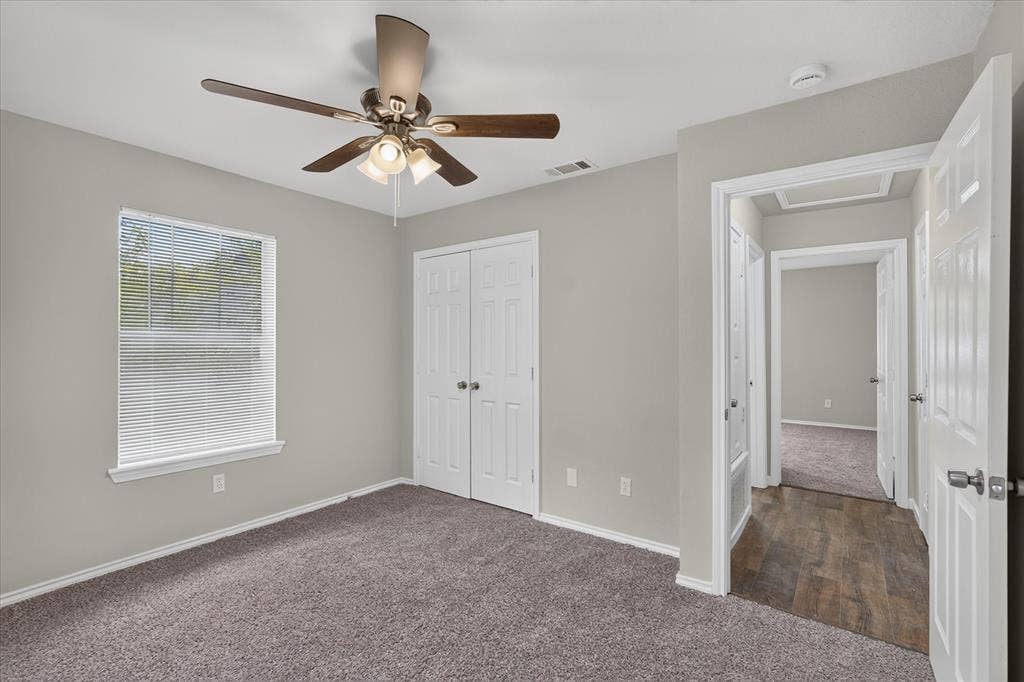 201 West Lane, West Tawakoni, TX 75474 Carpeted room with a ceiling fan light fixture
