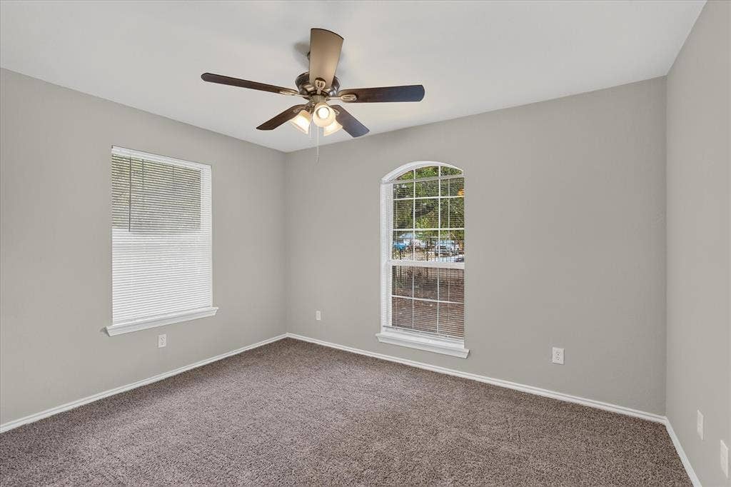 201 West Lane, West Tawakoni, TX 75474 Neutral paint palette and brown carpet flooring