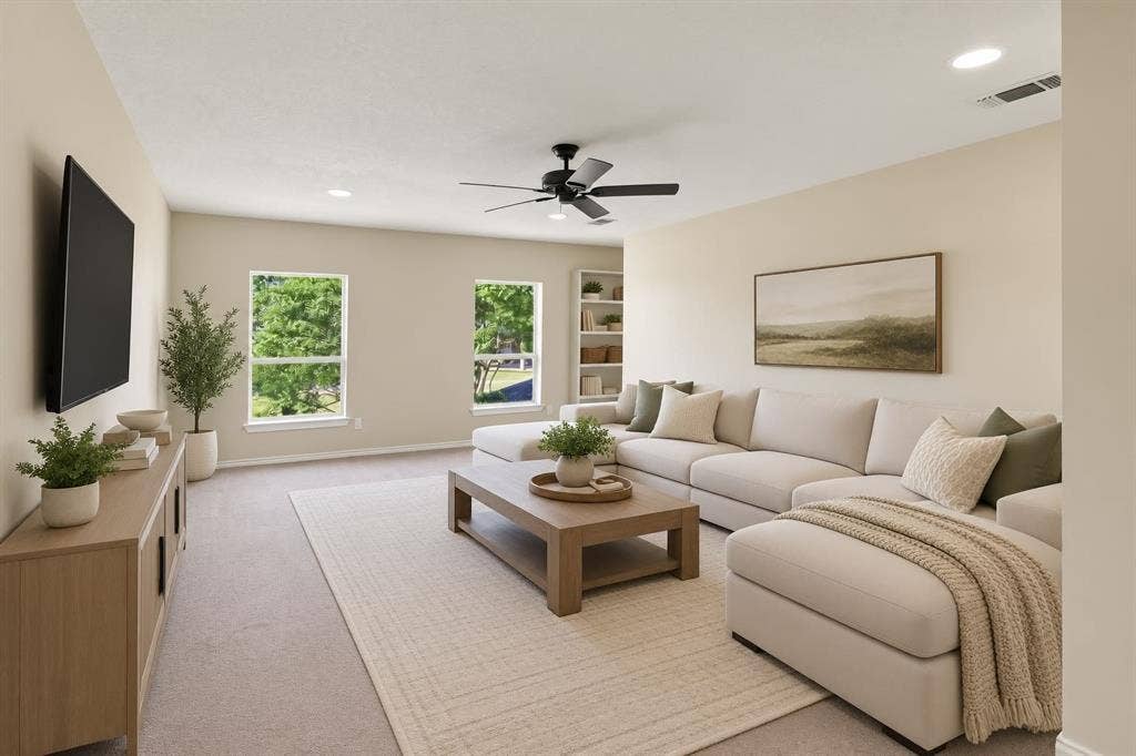 Spacious upstairs living area with abundant natural light, built-in shelving, and plenty of room for a media room, game room, or second family room.