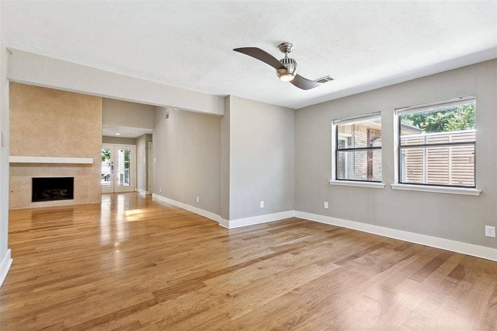 2937 Forest Hills Lane, Richardson, TX 75080 Hardwood flooring, contemporary ceiling fan, fireplace with mantel, French doors, multiple windows