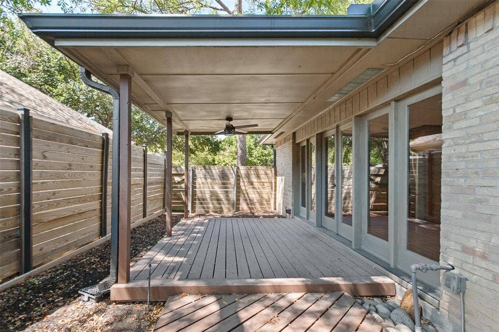 2937 Forest Hills Lane, Richardson, TX 75080 Covered patio featuring wood-finish decking and integrated ceiling fan