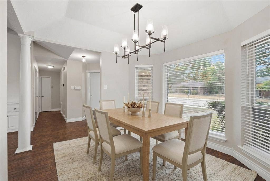 1309 Marigold Drive, Allen, TX 75002 Virtually staged. Dining room with updated, designer lighting, pretty bay windows and great location with ease to the Kitchen.