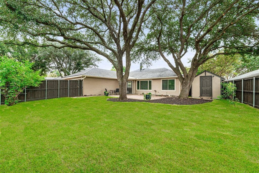 1309 Marigold Drive, Allen, TX 75002 Backyard views - note the storage shed great for organizing yard equipment and outdoor items.