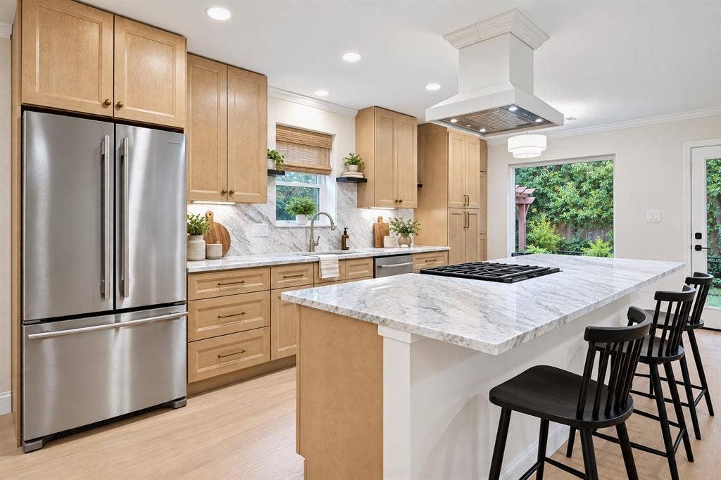 407 Valley Cove Drive, Richardson, TX 75080 White oak cabinets, gorgeous natural marble, KitchenAid appliances