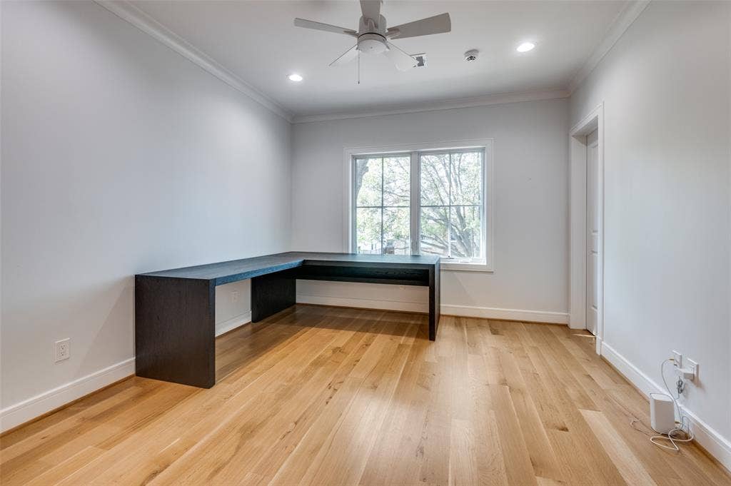 4031 Prescott Avenue, Dallas, TX 75219 Recessed lighting, wood-finish flooring, crown molding, built-in desk, and a ceiling fan