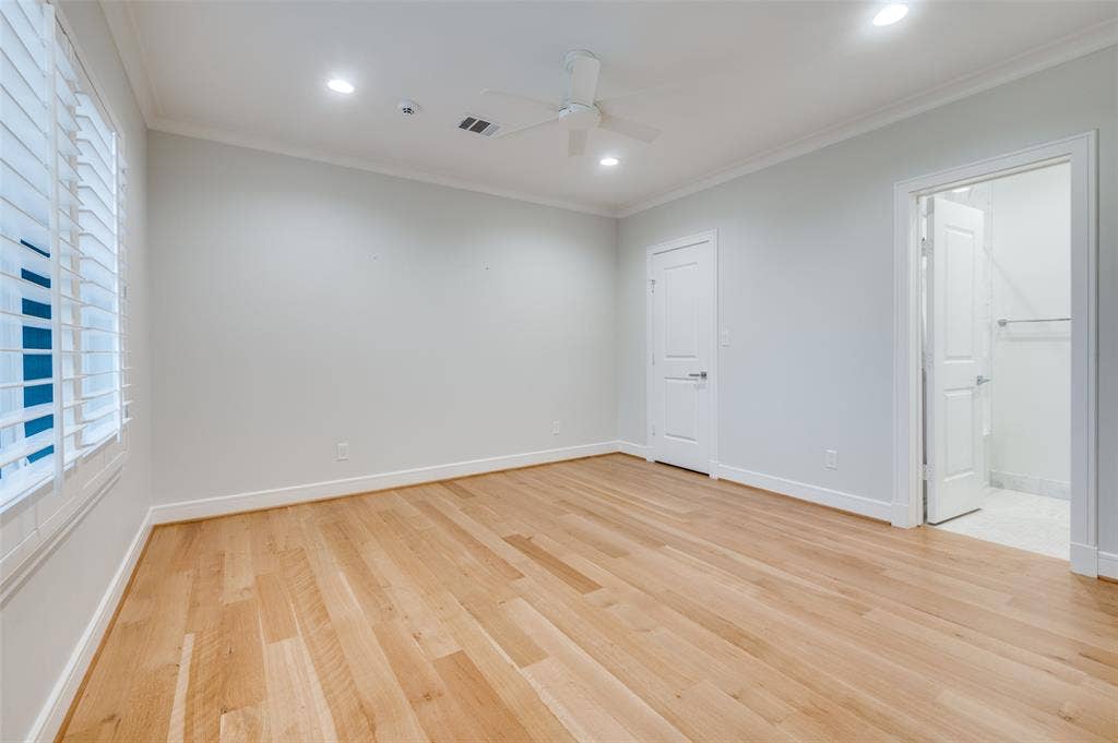 4031 Prescott Avenue, Dallas, TX 75219 Hardwood flooring, recessed lighting, crown molding, plantation shutters, and a ceiling fan