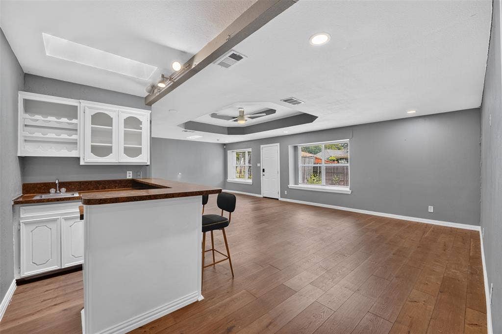 4730 Chilton Drive, Dallas, TX 75227 3rd Family room has a bar, beverage fridge and wine cabinets