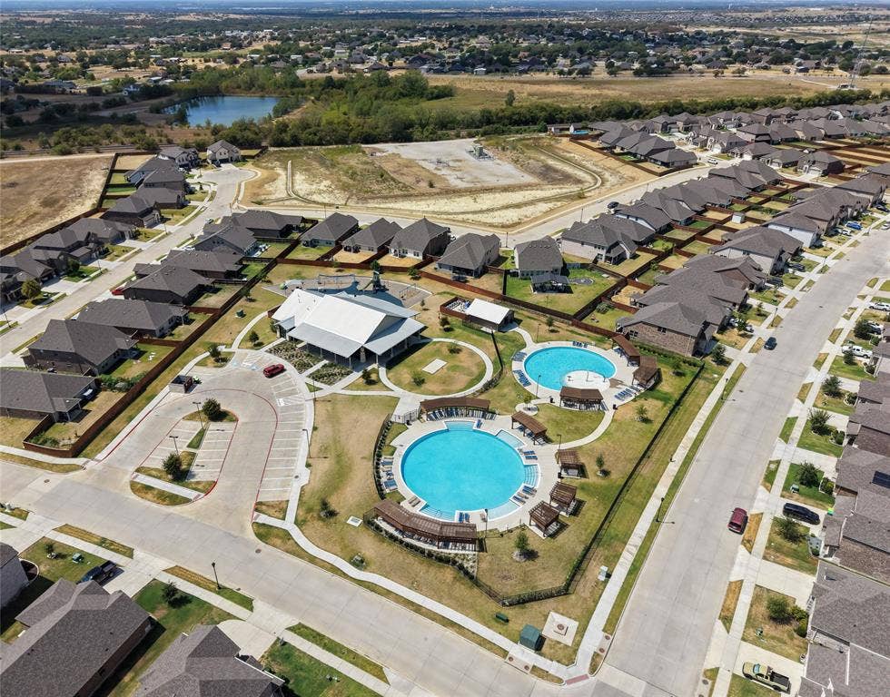 Community amenities include two swimming pools, a central clubhouse, and dedicated parking