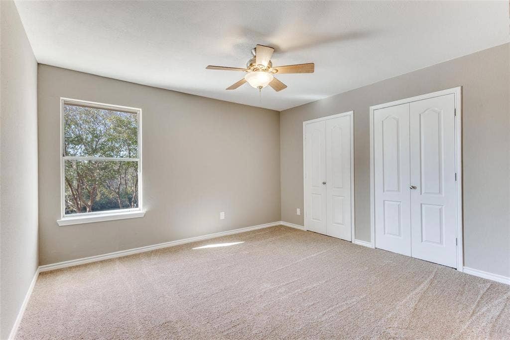 2822 Roundrock, McKinney, TX 75072 Bedoom upstairs - Neutral color palette, NEW carpeted, ceiling fan with light fixture, large closet.