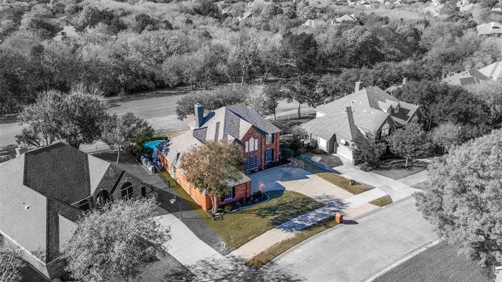 2822 Roundrock, McKinney, TX 75072 Brick exterior with multiple gables, an attached garage, and a private pool