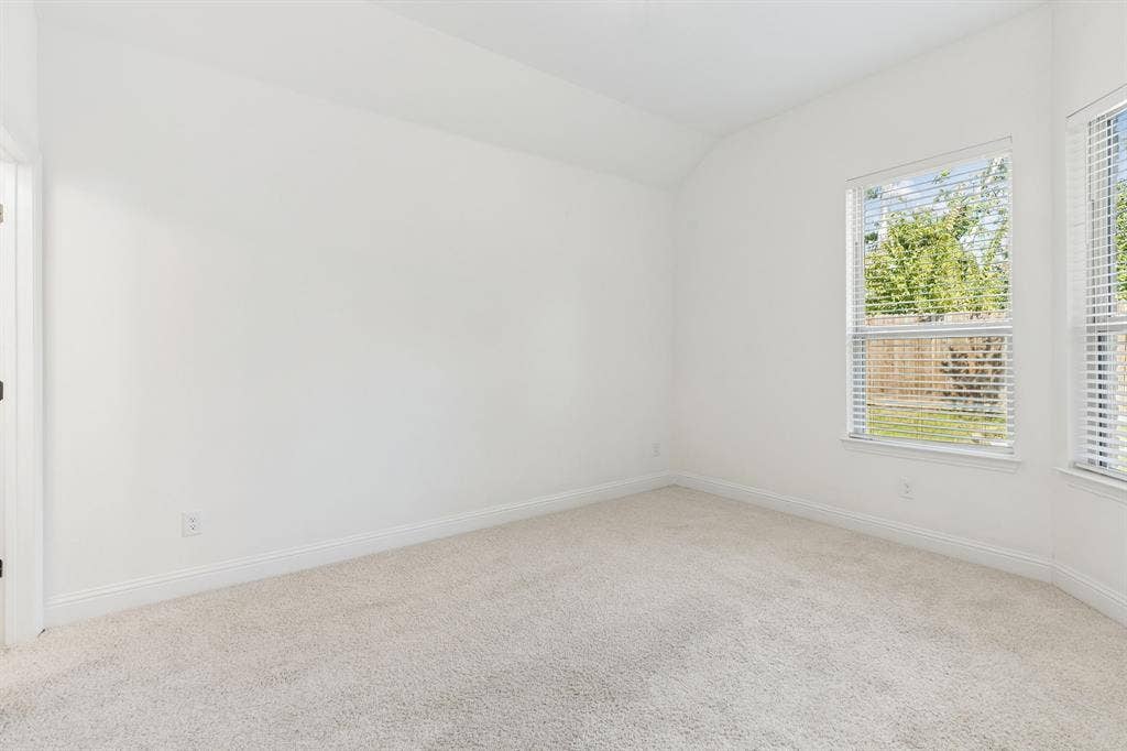5224 Troupe Road, McKinney, TX 75071 Vaulted ceiling, two windows with blinds, light-toned carpet flooring, white walls, white trim