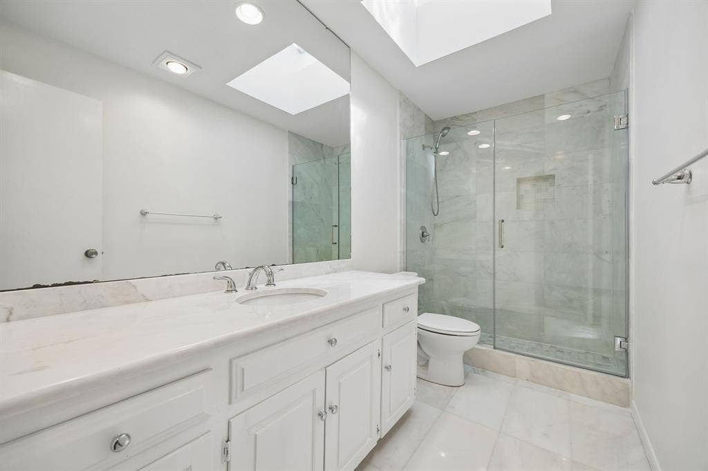 6542 Clearhaven Circle, Dallas, TX 75248 Hall entry bath boasts updates