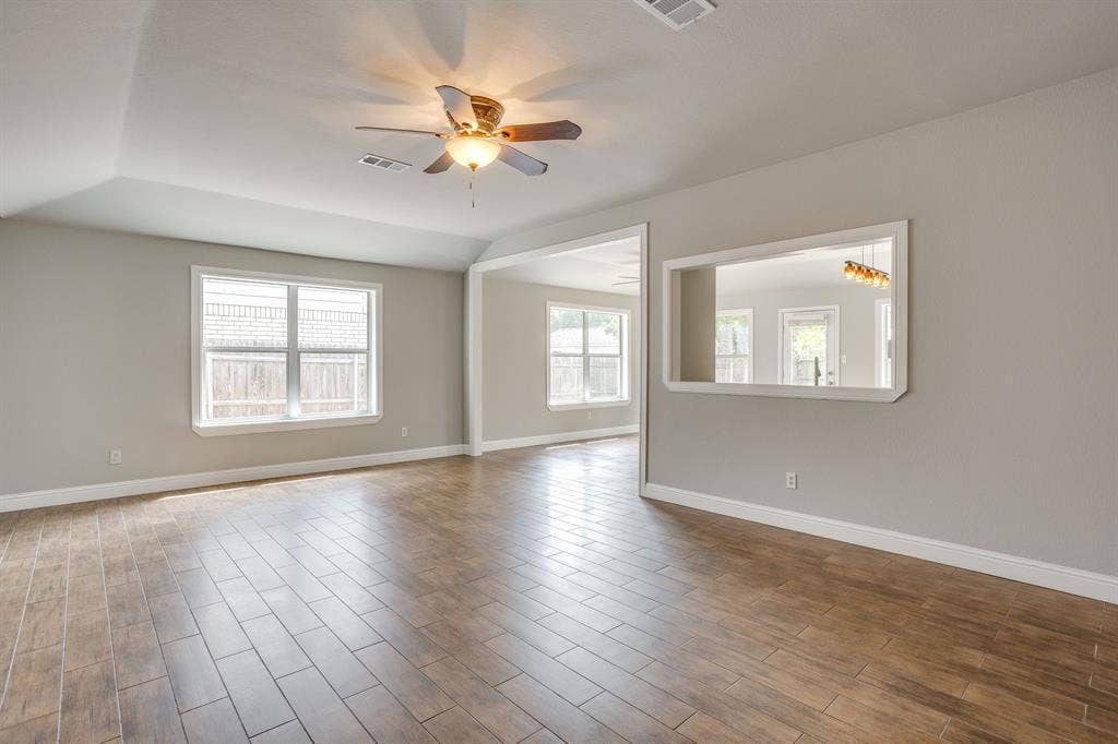 9825 Stoney Bridge Road, Fort Worth, TX 76108 View of living room looking into the dining & kitchen.