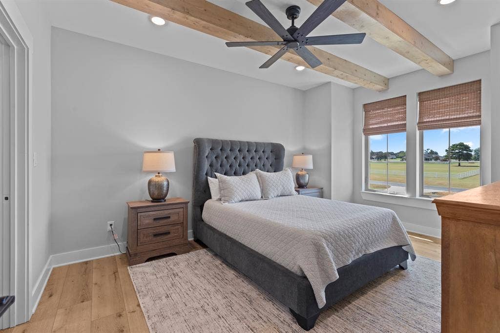 23180 Bridle View Drive, Lindale, TX 75771 Wood-finish flooring with a neutral area rug