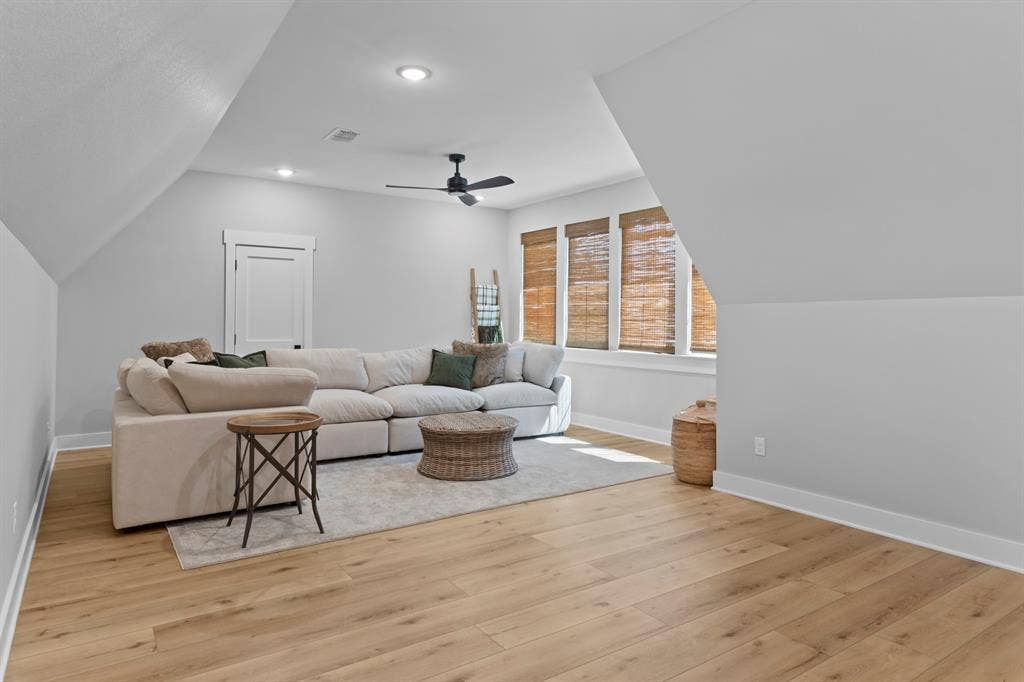 23180 Bridle View Drive, Lindale, TX 75771 Wood-finish flooring, recessed lighting, and a ceiling fan create a comfortable atmosphere