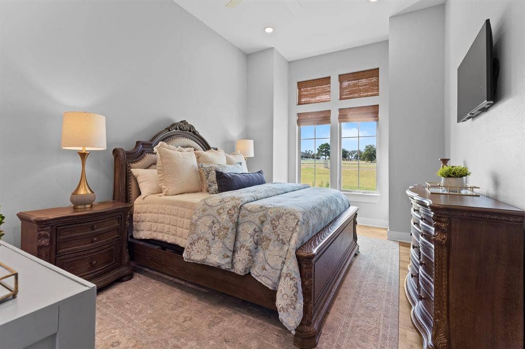 23180 Bridle View Drive, Lindale, TX 75771 Recessed lighting, light wood-finish flooring, and multiple windows with woven window treatments