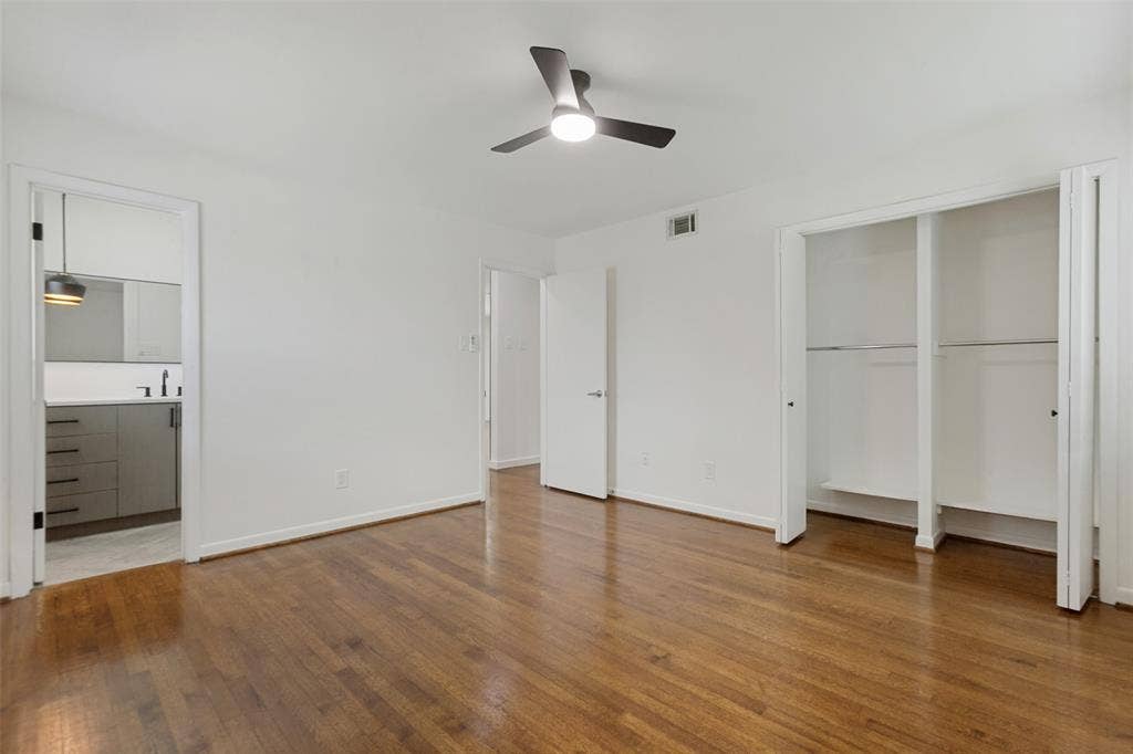 2413 Patricia Lane, Garland, TX 75041 Primary Bedroom with view of ensuite bathroom and peek into the closet