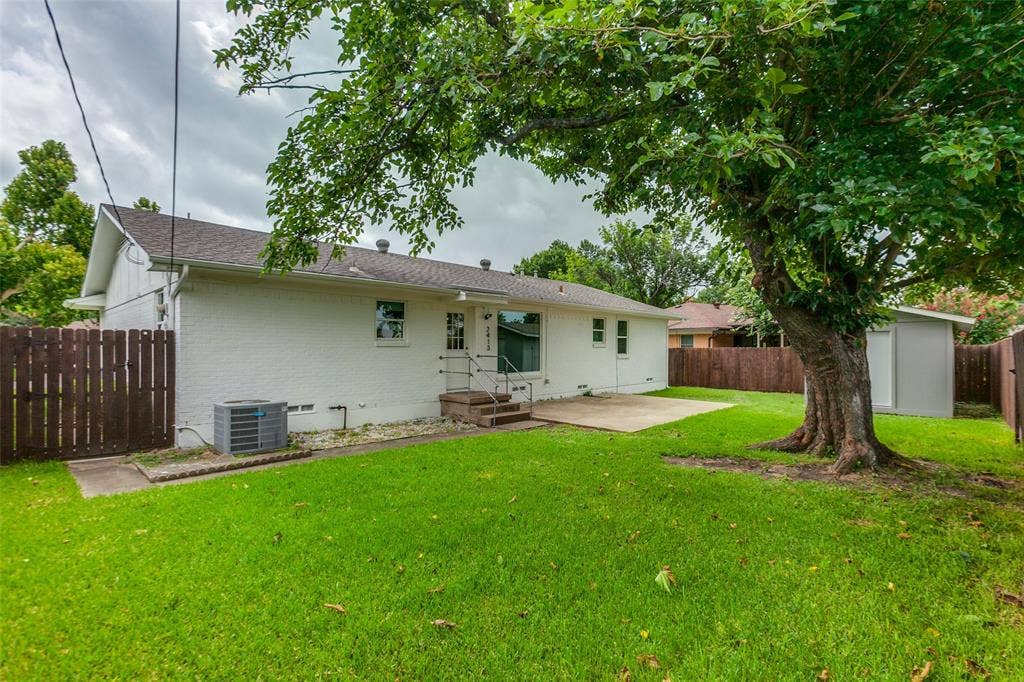 2413 Patricia Lane, Garland, TX 75041 Backyard with view of back of house